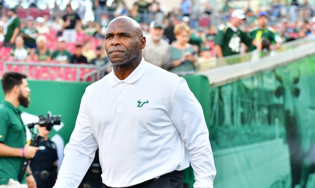 TAMPA, FLORIDA - NOVEMBER 23: Head coach Charlie Strong of the South Florida Bulls enters the field...