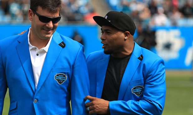 (L-R) Former Carolina Panthers players, Jake Delhomme and Steve Smith speak before the game against...