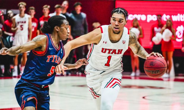 Utah sophomore forward Timmy Allen fends off a University of Texas at Tyler defender during the Ute...