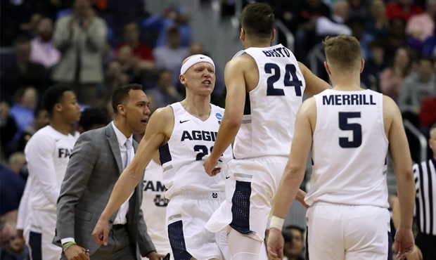 Brock Miller #22 and Diogo Brito #24 of the Utah State Aggies react as they take on the Washington ...