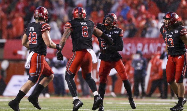 The Utah Utes celebrate during the second half of an NCAA football game at Rice-Eccles Stadium in S...