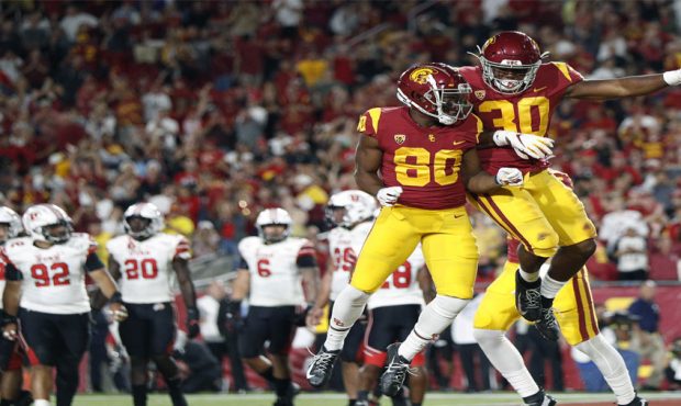 Wide receiver John Jackson III #80 of the USC Trojans celebrates the touchdown of running back Mark...