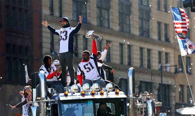 Kyle Van Noy #53 of the New England Patriots and Ja'Whaun Bentley #51 celebrate on Cambridge street...