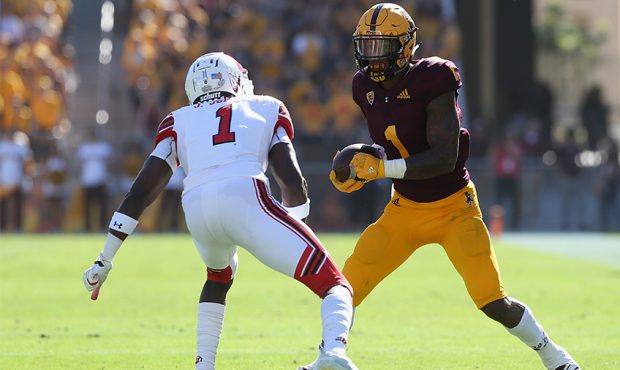 Wide receiver N'Keal Harry #1 of the Arizona State Sun Devils runs with the football after a recept...