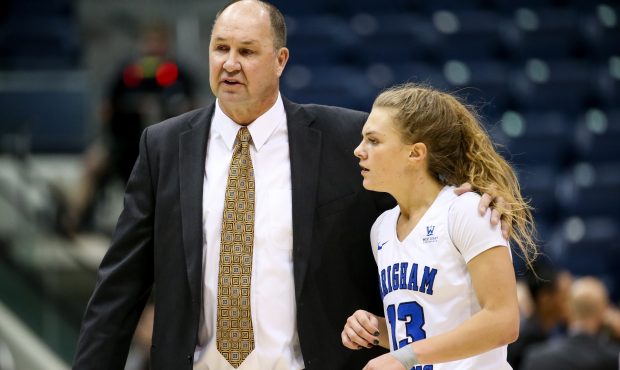 Brigham Young Cougars head coach Jeff Judkins talks with guard Paisley Johnson (13) at the Marriott...