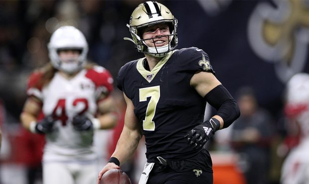 Taysom Hill #7 of the New Orleans Saints celebrates after a touchdown against the Arizona Cardinals...