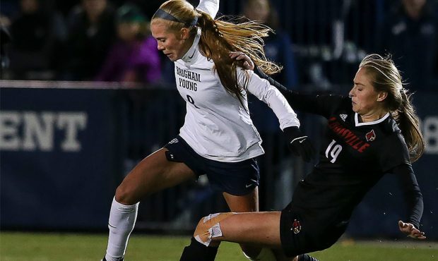 BYU's 8 Mikayla Colohan beats Louisville's 19 Maisie Whitsett during the NCAA soccer tournament at ...