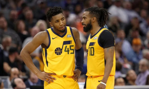Utah Jazz guards Donovan Mitchell, left, and Mike Conley talk during a break in the action during t...