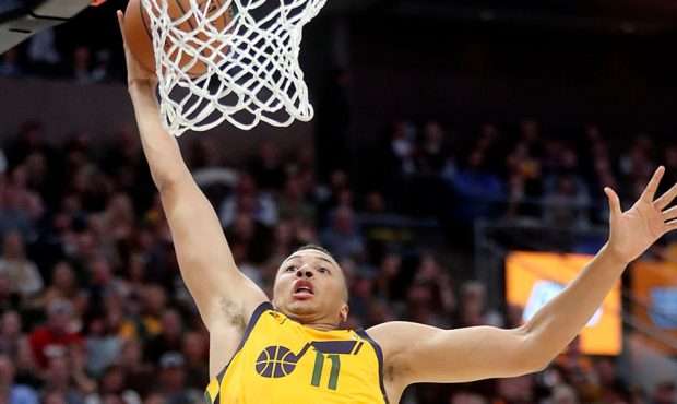 Utah Jazz guard Dante Exum (11) dunks the ball after a pass interception during an NBA basketball g...