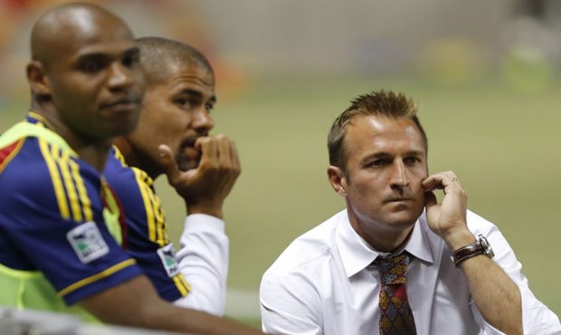 Head Coach of Real Salt Lake head coach Jason Kreis talks to other pliers and coaches during a game...