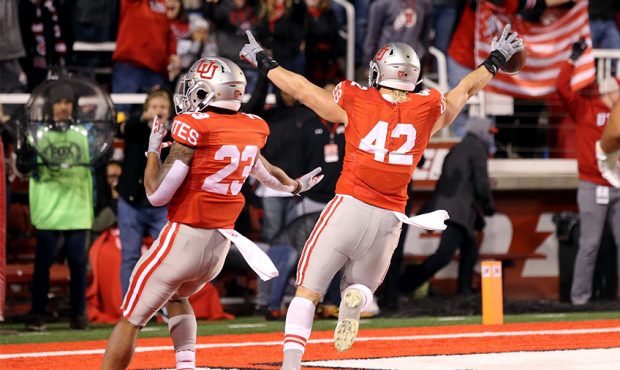 Utah Utes defensive end Mika Tafua (42) celebrates a touchdown after picking up a UCLA fumble as Ut...