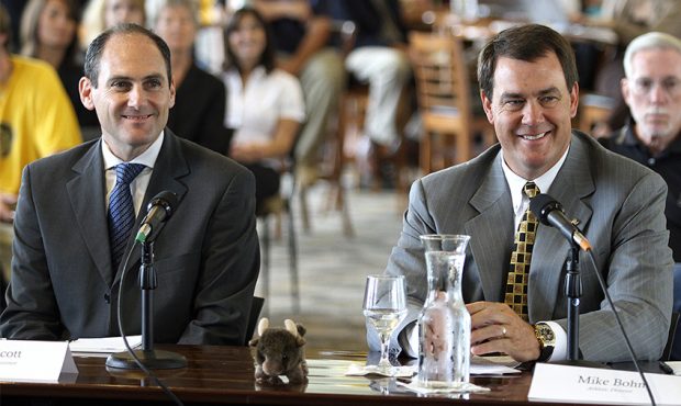 PAC-10 Commissioner Larry Scott (L) and University of Colorado Athletic Director Mike Bohn smile as...