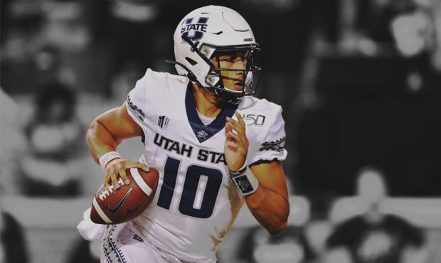 Jordan Love #10 of the Utah State Aggies rolls out against the Wake Forest Demon Deacons during the...