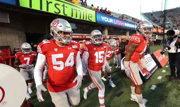 Utah players take the field to warm up as they prepare to play UCLA in a college football game in S...