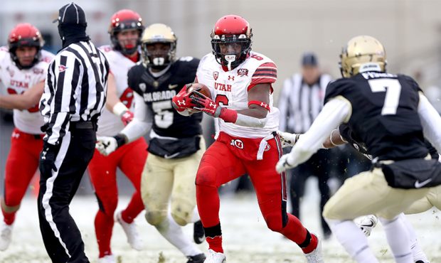 Armand Shyne #6 of the Utah Utes carries the ball against the Colorado Buffaloes in the third quart...