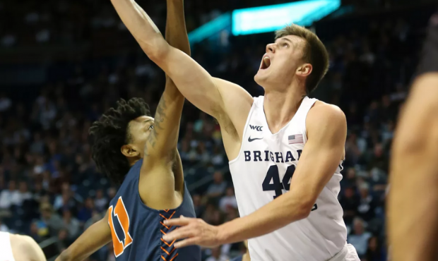 Brigham Young Cougars guard Connor Harding (44) puts up a shot over Cal State Fullerton Titans guar...