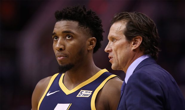 Head coach Quin Snyder of the Utah Jazz talks with Donovan Mitchell #45 during the first half of th...