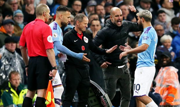 Pep Guardiola, Manager of Manchester City speaks to Sergio Aguero of Manchester City as he is repla...