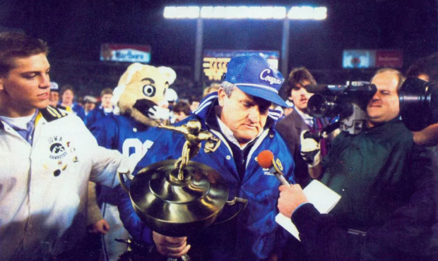 BYU football coach LaVell Edwards walks off the field with the 1984 Holiday Bowl trophy.  O Wallace...
