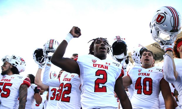 The Utah Utes celebrate after defeating the Washington Huskies 33-28 during their game at Husky Sta...