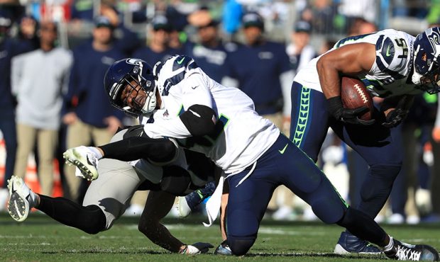 Seattle Seahawks middle linebacker Bobby Wagner #54 intercepts a pass intended for Carolina Panther...