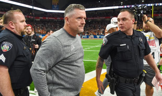 Utah Utes head coach Kyle Whittingham departs the field following the Alamo Bowl football game betw...