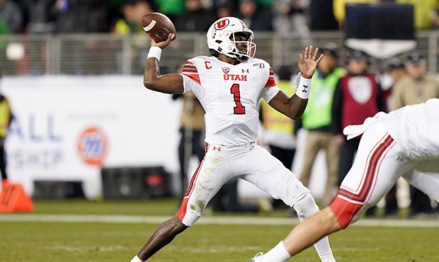 Quarterback Tyler Huntley #1 of the Utah Utes looks to pass against the Oregon Ducks during the fir...