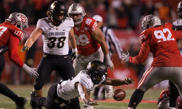 Alex Fontenot #8 of the Colorado Buffaloes fumbles the ball against the Utah Utes in the first half...