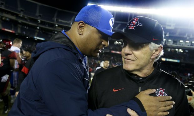 BYU coach Kalani Sitake and San Diego State Aztecs coach Rocky Long greet one another after the gam...