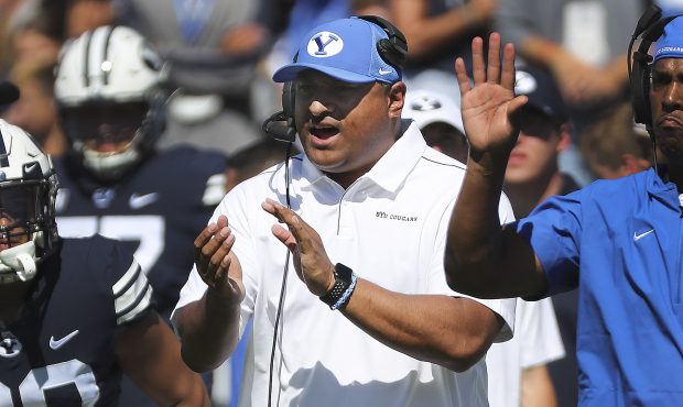 Brigham Young Cougars head coach Kalani Sitake applauds a field goal in Provo on Sept 14, 2019. BYU...