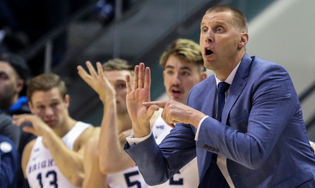 Brigham Young Cougars head coach Mark Pope calls a play during the first half of an NCAA basketball...