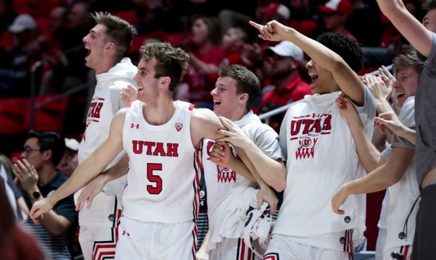 Utah Utes players cheer as they lead the Washington State Cougars in the final moments of the game ...