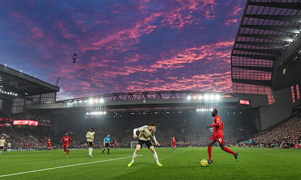 Saido Mane of Liverpool in action as the sun sets during the Premier League match between Liverpool...