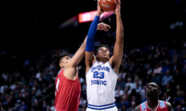 Brigham Young Cougars forward Yoeli Childs (23) goes to the hoop ahead of Loyola Marymount Lions fo...