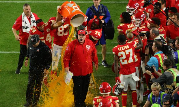 Head coach Andy Reid of the Kansas City Chiefs gets dunked in Gatorade after defeating the San Fran...