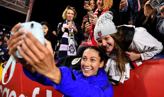 Christen Press #20 the United States takes a photograph with a fan after United State defeated Mexi...