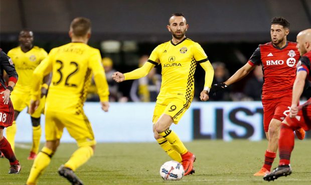 Justin Meram #9 of the Columbus Crew SC controls the ball during the match against the Toronto FC a...