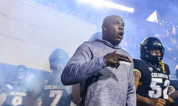 Head coach Mel Tucker of the Colorado Buffaloes leads players onto the field before a game against ...