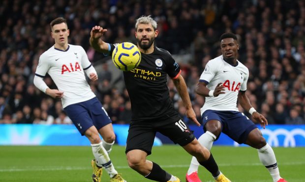 Sergio Aguero of Manchester City gets past Giovani Lo Celso and Serge Aurier of Tottenham Hotspur d...