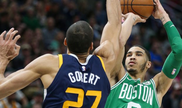 Boston Celtics forward Jayson Tatum (0) shoots over Utah Jazz center Rudy Gobert (27) (Spenser Heap...