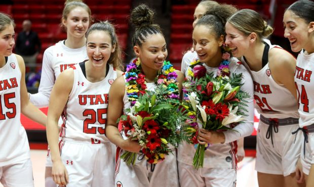 Utah Utes senior guards Kiana Moore (0) and Daneesha Provo (23) are recognized on senior day after ...