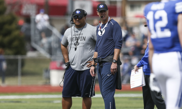Brigham Young Cougars head coach Kalani Sitake watches the team scrimmage during BYU's Spring Game ...
