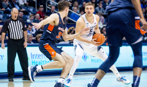 Brigham Young Cougars guard Jake Toolson (5) holds the ball in Provo on Thursday, Jan. 30, 2020. BY...