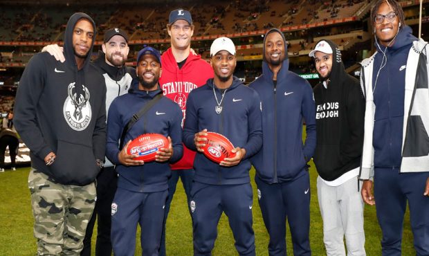 Team USA Basketball pose for a photograph during the 2019 AFL round 23 match between the Collingwoo...