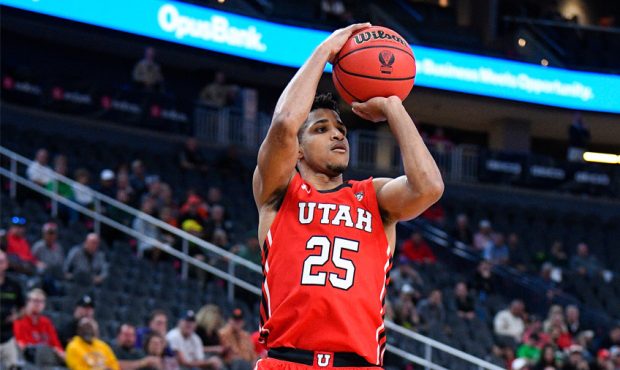 Utah Utes guard Alfonso Plummer (25) shoots a three pointer during the first round game of the men'...