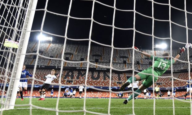 In this handout image provided by UEFA, Josip Ilicic of Atalanta scores his sides fourth goal past ...