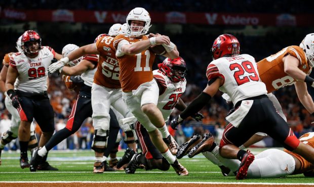 Sam Ehlinger #11 of the Texas Longhorns rushes for a touchdown which was called back by a penalty i...