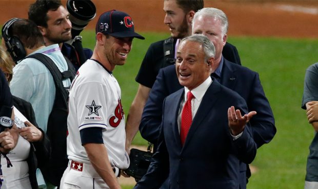 MLB commissioner Rob Manfred and All-Star game MVP Shane Bieber #57 of the Cleveland Indians during...