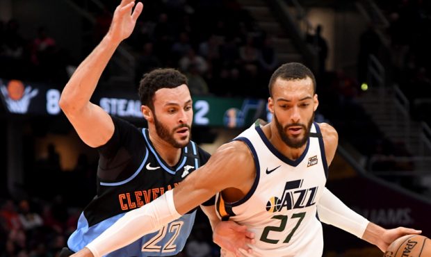 Rudy Gobert #27 of the Denver Nuggets drives past Larry Nance Jr. #22 of the Cleveland Cavaliers du...