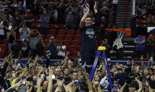 The Utah State Aggies celebrate after defeating the San Diego State Aztecs to win the championship ...